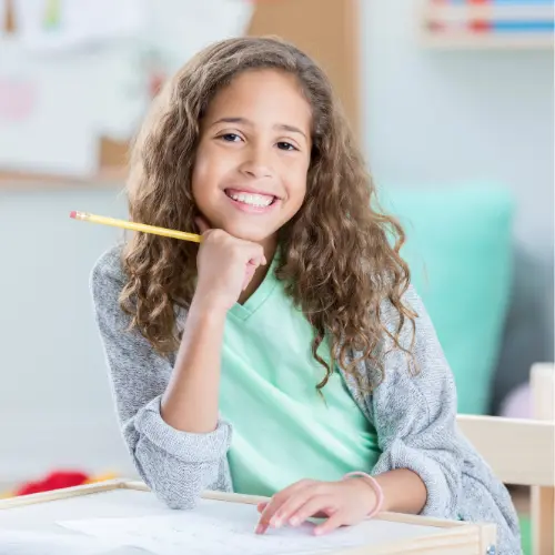 Practice Worksheet Hub - Home Page a girl sitting at a desk with a pencil on her chin
